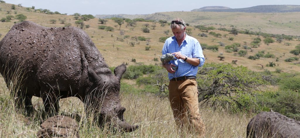Hamish sculpting rhino in the wild