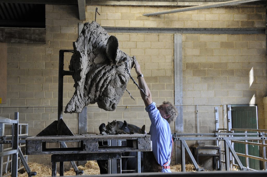 Hamish in workshop with bull head sculpture