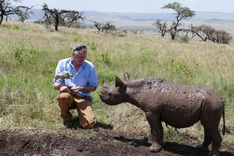 Hamish with baby black rhino in wild