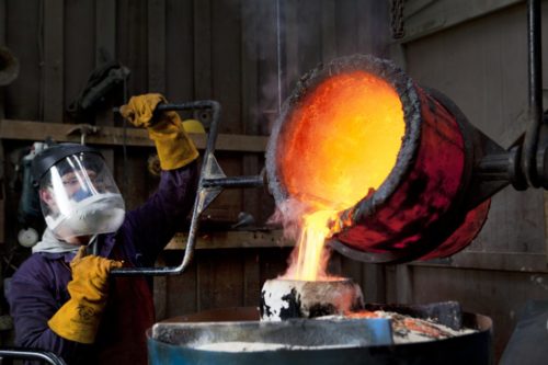Pouring bronze during lost-wax casting