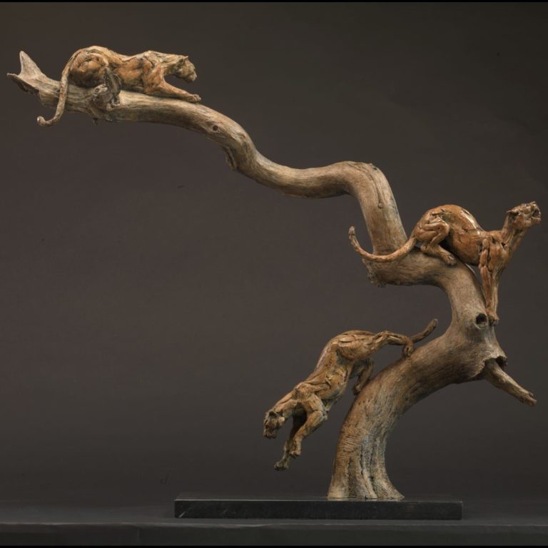 Leopards three in a tree sculpture