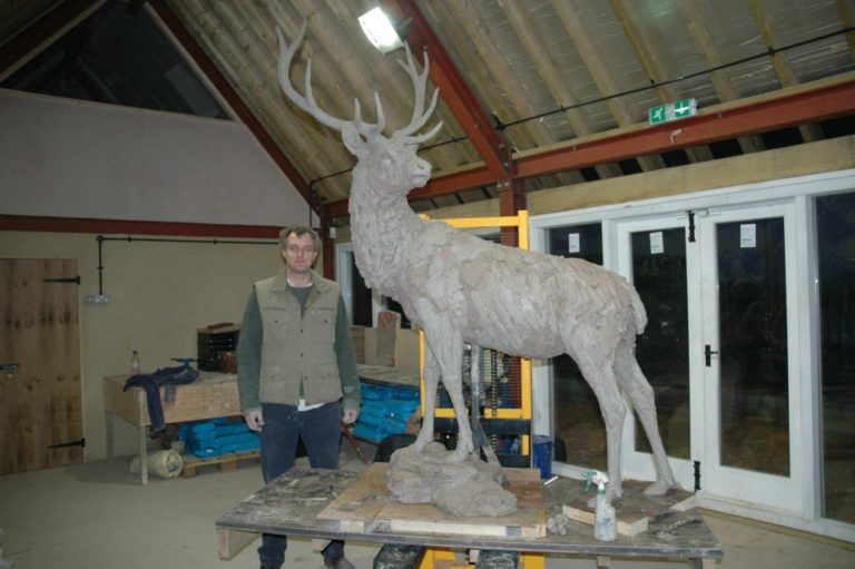 Hamish in studio with one of his deer sculptures