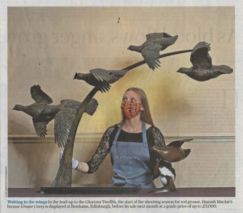 picture of woman with grouse sculpture
