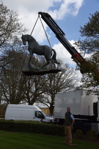 Andalusian sculpture being moved by crane
