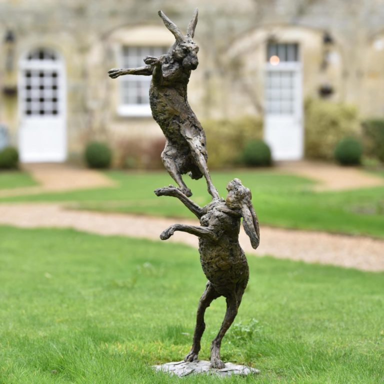 Bronze boxing hares sculpture