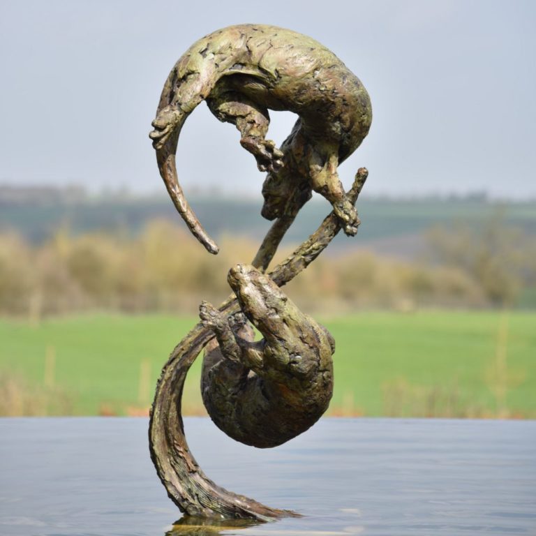 Bronze otter sculpture
