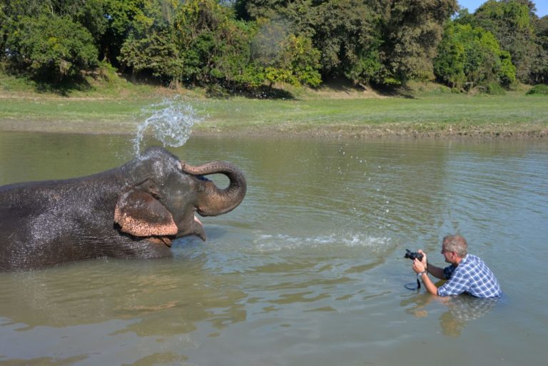 Hamish photographing elephant in water