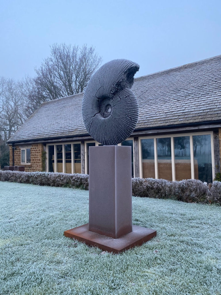Ammonite sculpture in the snow