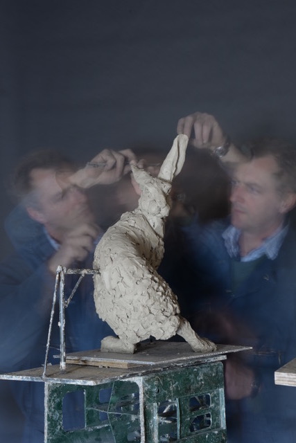 Hamish making hare sculpture