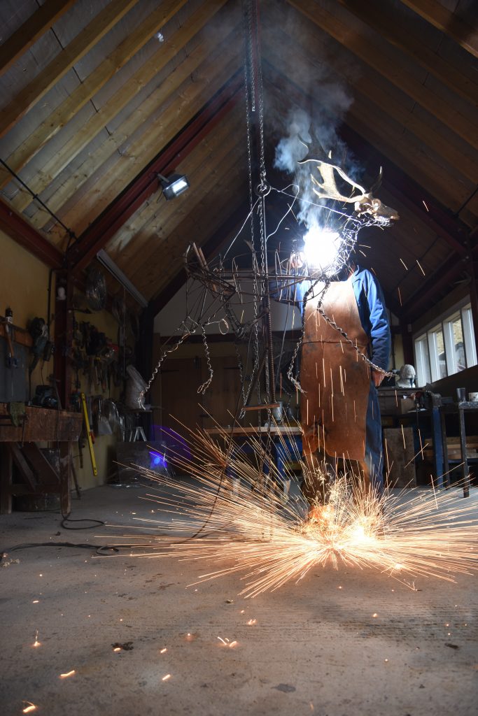 Hamish welding in his studio
