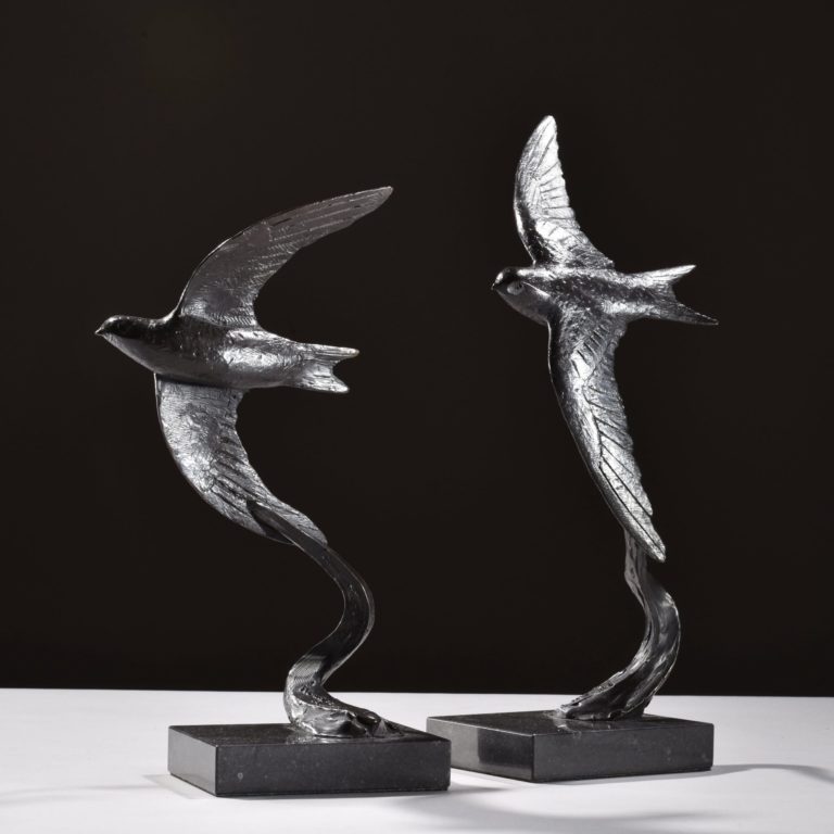 a pair of swift sculptures