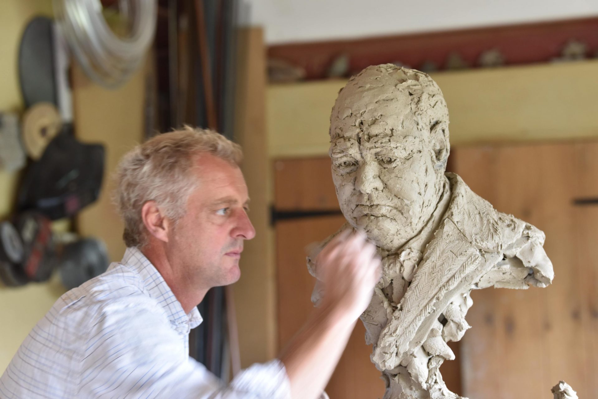 Hamish making Winston Churchill sculpture