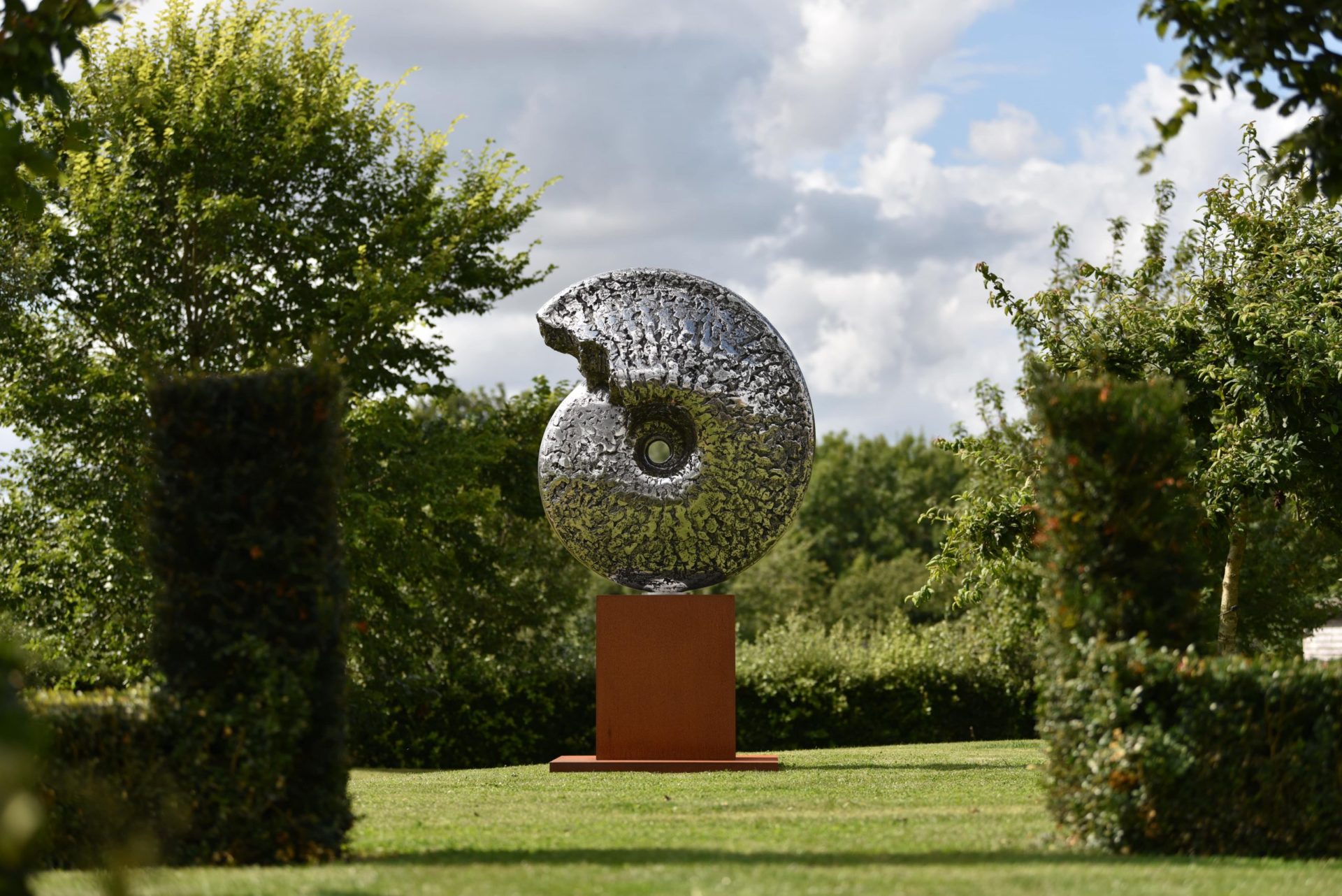 stainless steel sculpture of ammonite