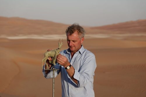 Hamish making gazelle sculpture in desert
