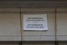 Notice on Paris building about Jim Morrison
