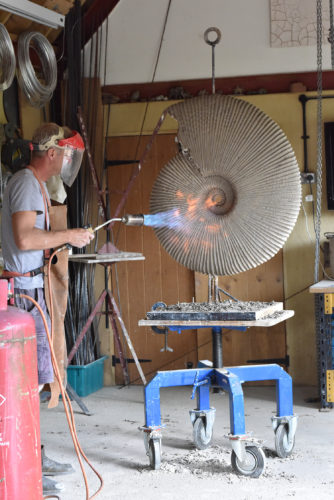 Hamish creating ammonite jurassic sculpture