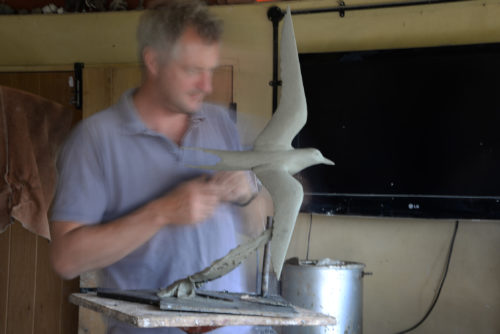 Hamish making arctic tern sculpture