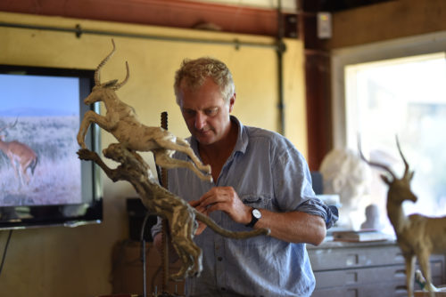 Hamish making cheetah impala kill sculpture