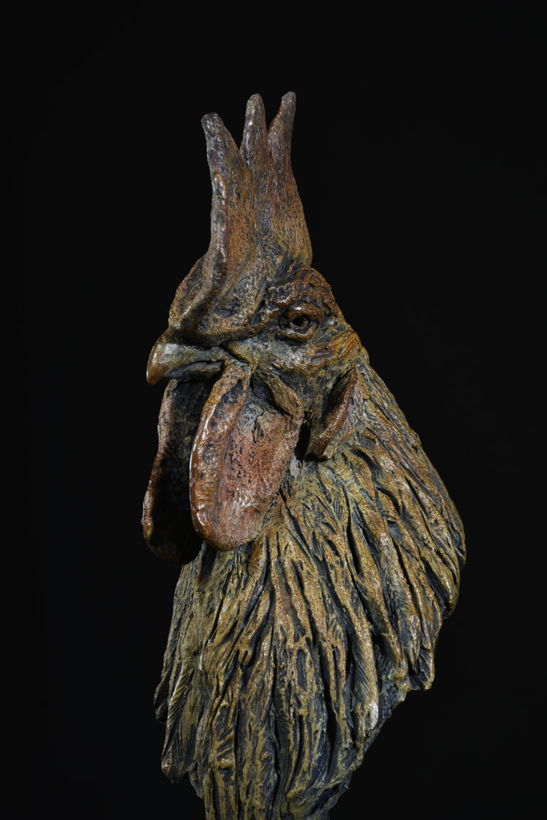 Mackie's bronze chicken head sculpture