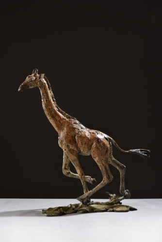 bronze giraffe running