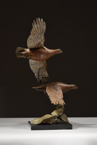 grouse in flight sculpture