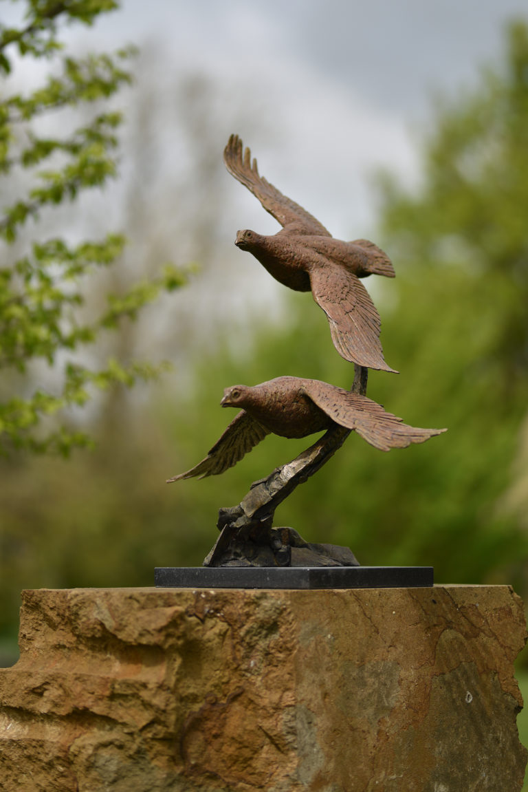 sculpture of two grouse