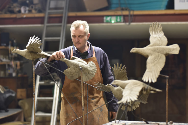 Hamish making grouse flushing sculpture