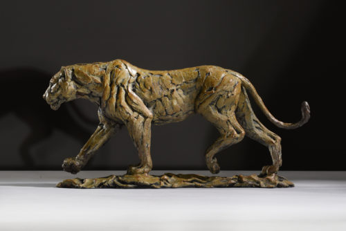 Lioness walking sculpture