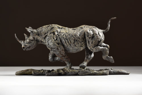bronze black rhino running