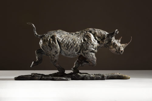 black rhino running sculpture