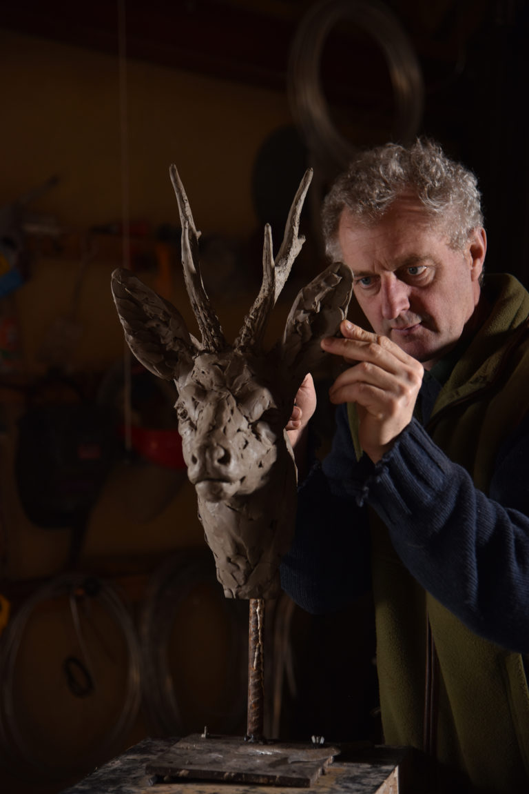 Hamish making roe buck sculpture