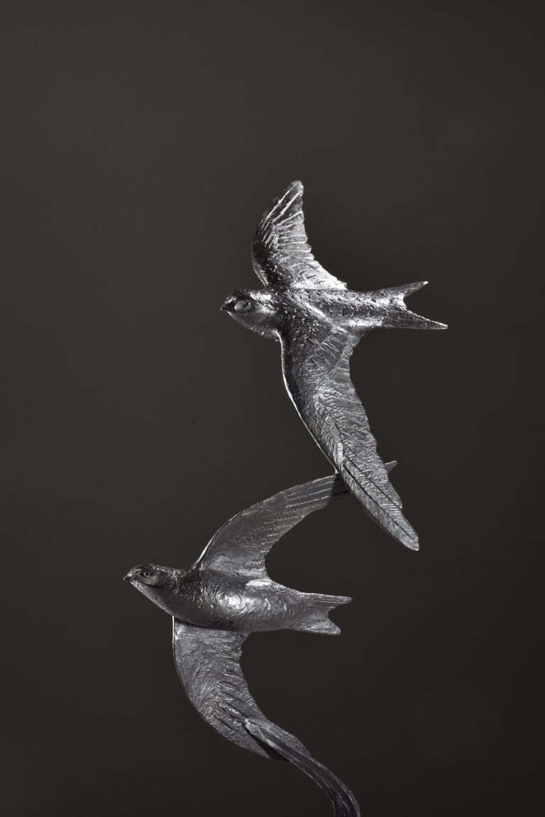 sculpture of bronze swifts