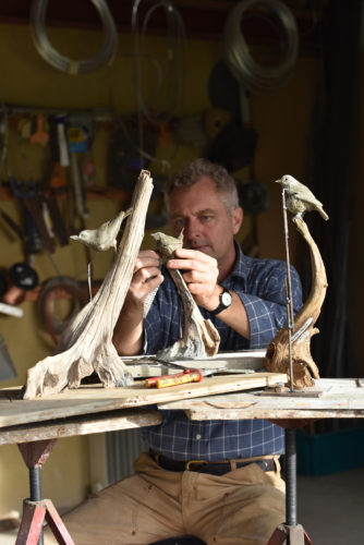 making bird sculptures in workshop