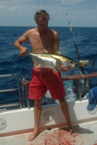 Hamish holding caught tuna fish