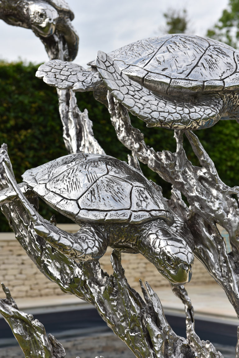 stainless steel sculpture of turtles