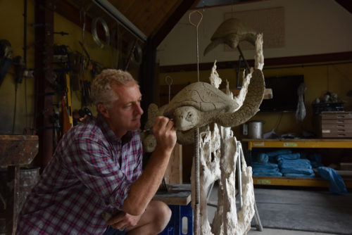 Hamish creating sculpture of turtles