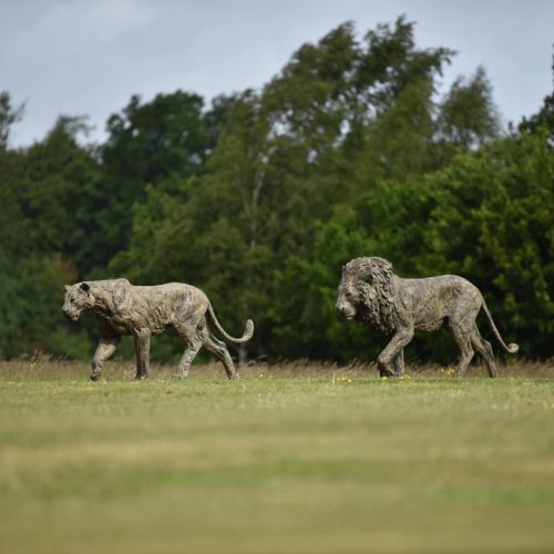 life-size sculptures of lion and lioness