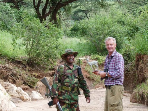 Hamish with a guide and holding clay dik dik