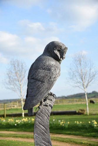 Owl sculpture in garden