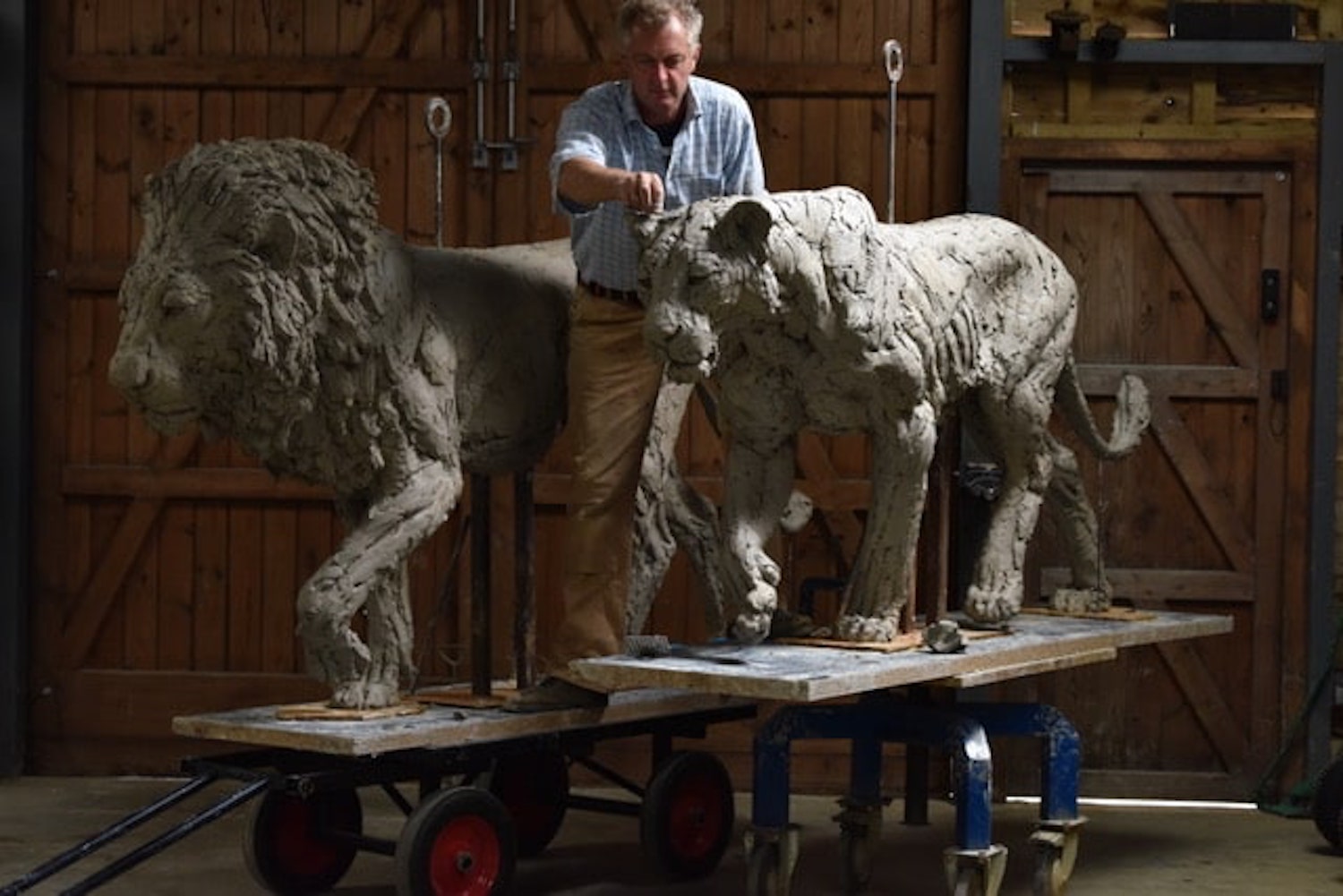 Hamish with lions in clay for sculpture commissions