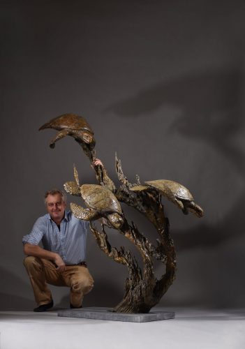 Hamish Mackie with bronze turtles sculpture