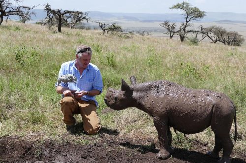 Hamish with wild baby rhino