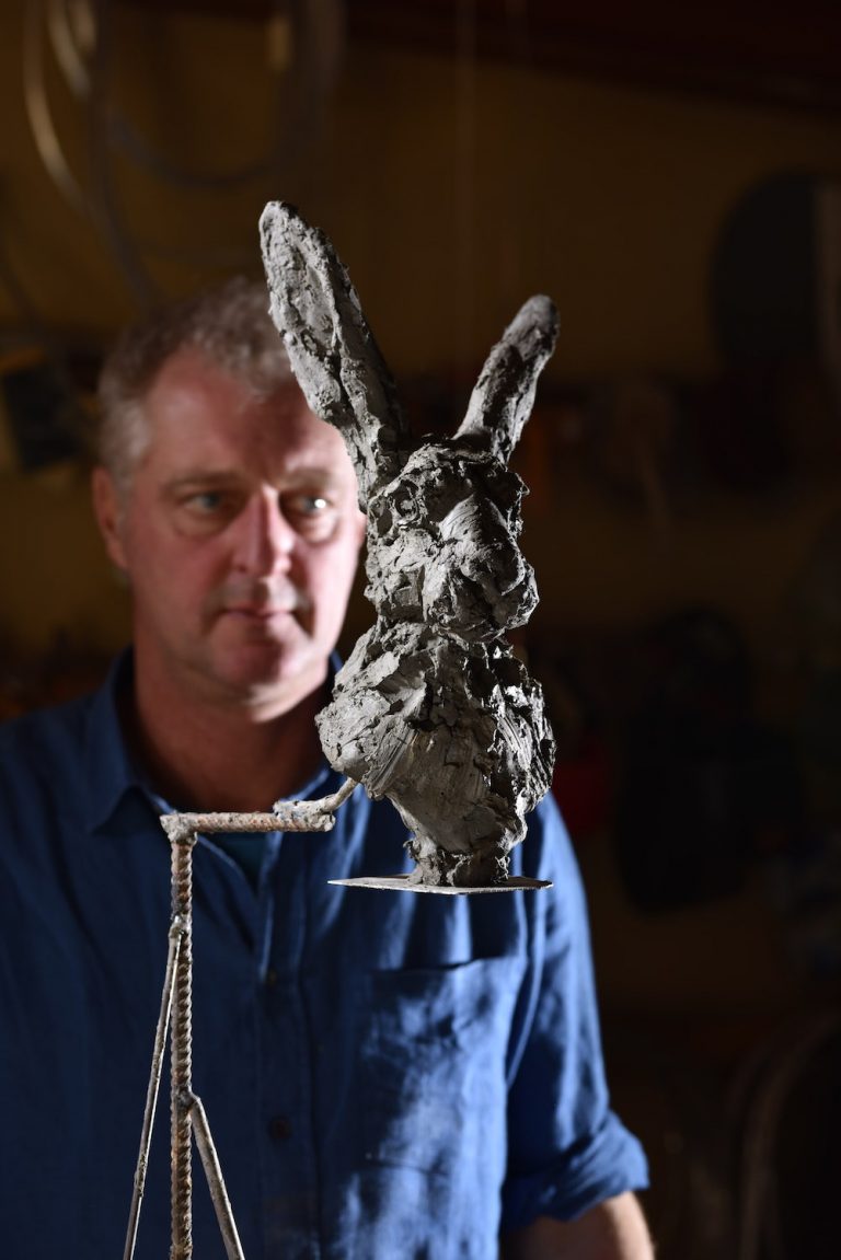 Hamish with clay model of hare head
