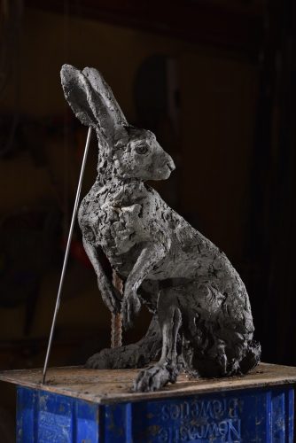 clay model of hare looking back