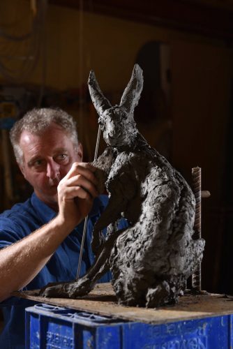 Hamish working on Hare Looking Back sculpture