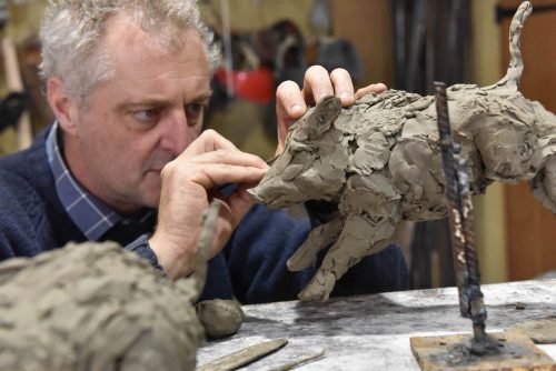 Hamish working on wild boar sounder sculpture