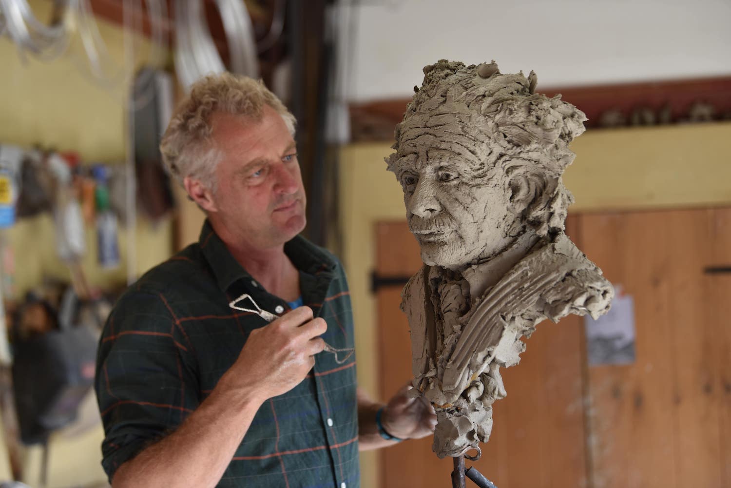 Hamish Mackie making Einstein sculpture in clay
