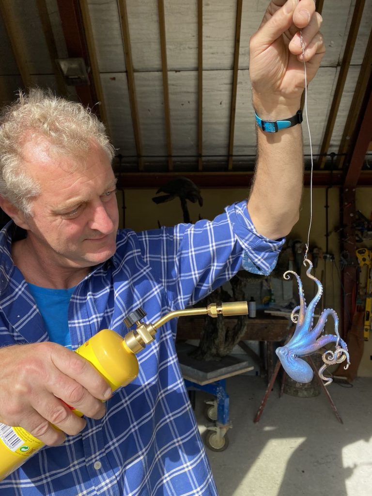 Hamish patinating Titanium octopus
