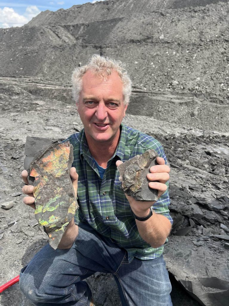 Hamish holding ammolite finds