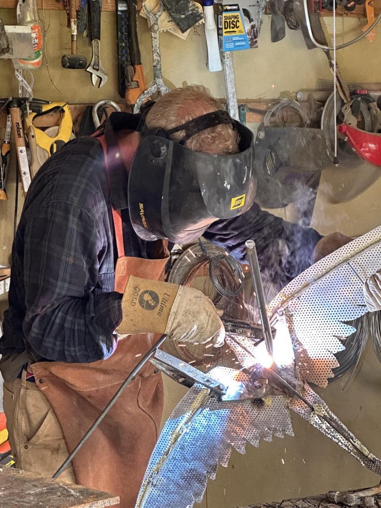 Hamish welding in workshop